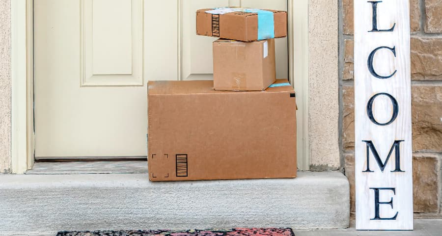 Deliveries on the front porch of a house with a welcome sign in Spokane